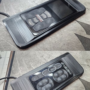 May include: Two black remote controls with buttons and a small screen. The top remote has the text "AirLift Performance" on it. The bottom remote has the text "c-Level+  AirRide" on it.