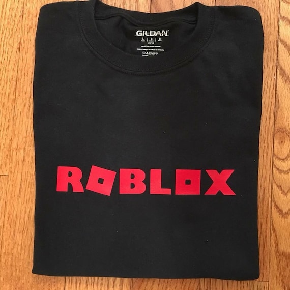 Children S Roblox T Shirt Etsy - roblox logo game oof ripetitive red paint gamer roblox sticker teepublic