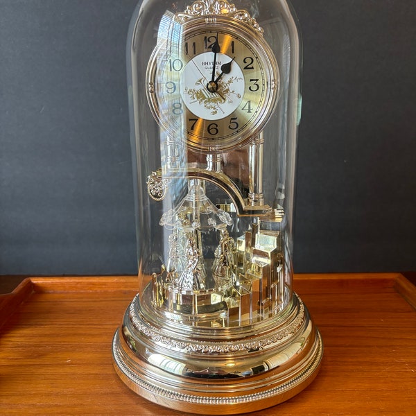 Rythem Quartz Dome Clock, Works great, Excellent Condition, Dancing Couple Rotates and plays music, Mantel Clock, Made in Japan