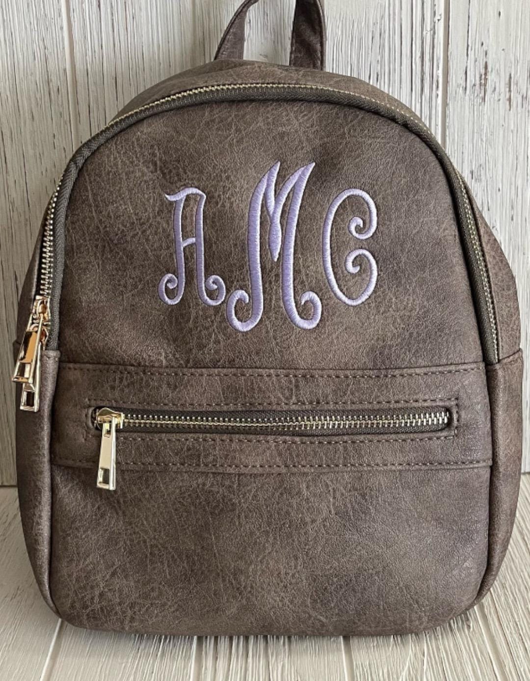 brown leather backpack purse Mini Pebble Crossbody | Glam-Aholic Lifestyle | | Vegan | Small 40L Color:Black/ Dark Charcoal Piel Leather Drawstring Backpack Height x 12 in