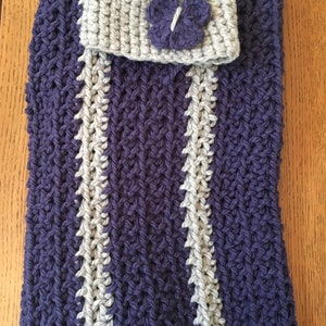 May include: A purple and gray striped crocheted baby blanket with a matching gray crocheted hat with a purple crocheted butterfly on top.