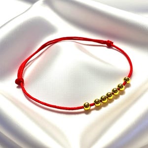 Pulseira da Proteção | Ouro Vermeil 14k com 7 Contas - Joia da Prosperidade | Cordão Vermelho Ajustável com Nó Deslizante