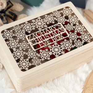 May include: A wooden box with a snowflake design and the text "Zachary's Christmas Fave Box" on the lid.