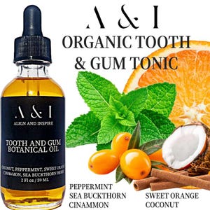 May include: A&I Align and Inspire Organic Tooth & Gum Tonic botanical oil in a clear glass bottle with a black dropper cap. The bottle is labeled with the product name and ingredients: Coconut, Peppermint, Sweet Orange, Cinnamon, Sea Buckthorn Berry. 2 fl oz / 59 ml. The image also shows ingredients like peppermint leaves, orange slices, sea buckthorn berries, coconut, and cinnamon sticks.