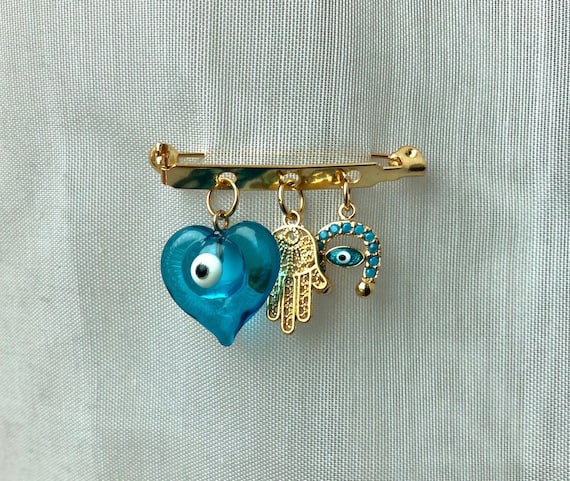 Jewish Charms Gold Baby Safety Pin in 14K Gold | Izakov Fine  Jewish stroller evil eye protection pin display picture 1