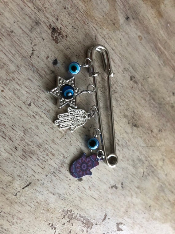 Jewish Charms Gold Baby Safety Pin in 14K Gold | Izakov Fine  Jewish stroller evil eye protection pin display picture 1