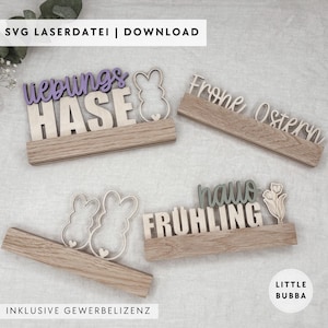 Könnte beinhalten: Osterdekorationen aus Holz mit Sätzen wie "Lieblings Hase" und "Frohe Ostern". Jedes Stück hat eine Holzbasis mit lasergeschnittenen Buchstaben und Hasen- oder Blumenakzenten. Der Text "SVG LASERDATEI | DOWNLOAD" ist sichtbar.