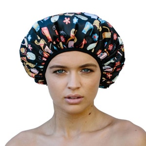 Woman wearing double layer everyday shower cap - black with cats pattern