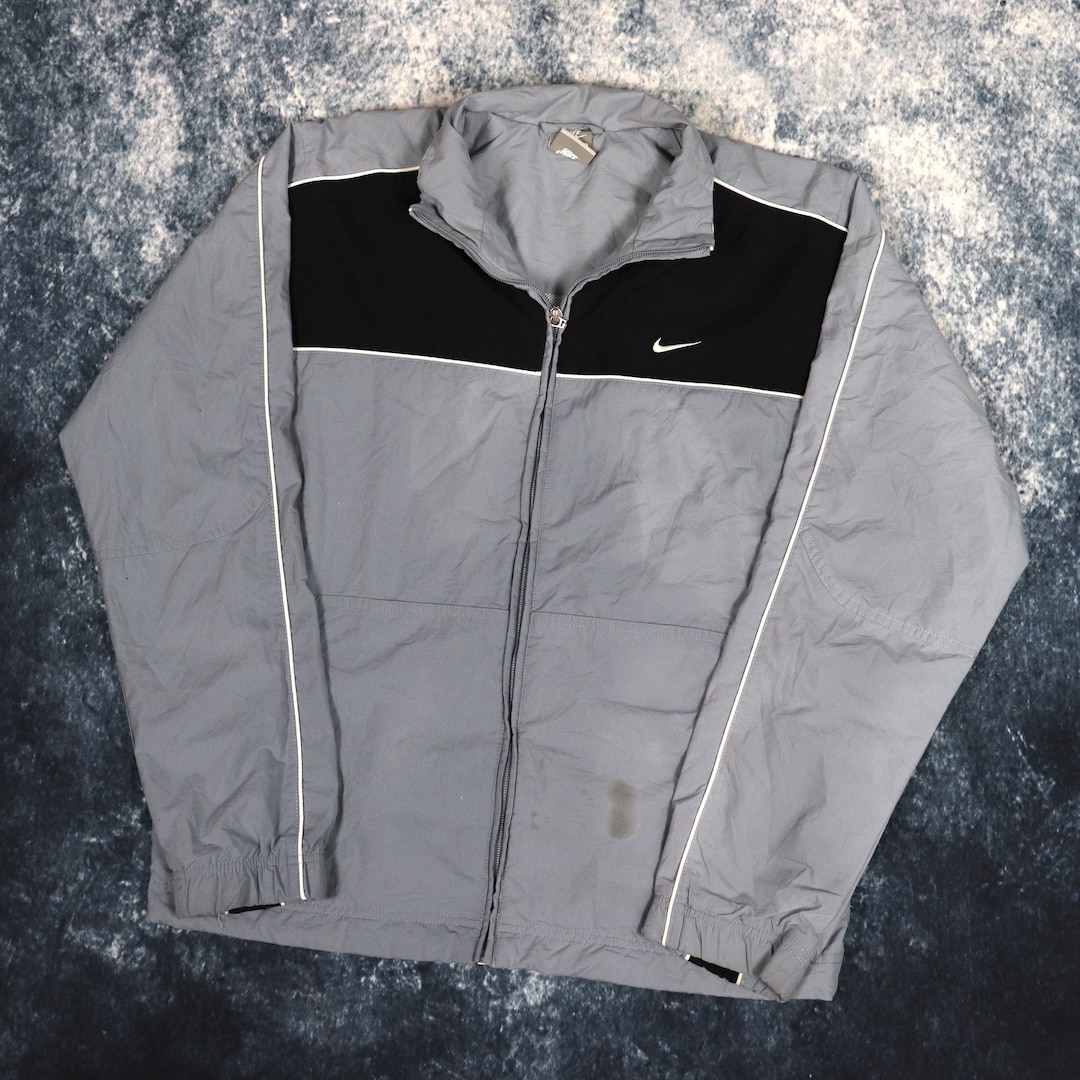 white grey and black nike windbreaker