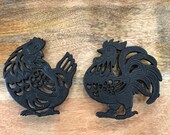 Black cast iron trivet hot plates. Cockerel rooster and hen designs. approx. 15cm wide