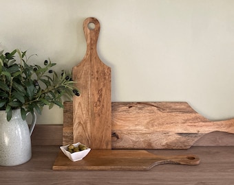 Mango wood loop handled paddle boards. Mezze platter, chopping or food presentation board, serving tray, or trivet, the uses are endless