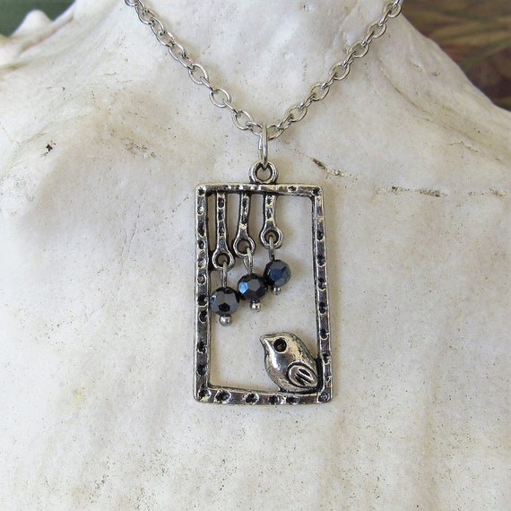 Vintage Gold Tone and Caged Black Beads 24 Inch Necklace with Spring Ring Clasp.
