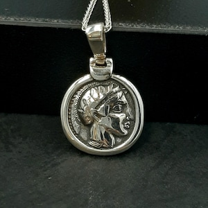 Athinas hand side, in silver chain with the 925 Sterling silver stamp.