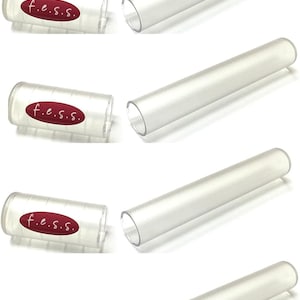 May include: Four sets of clear plastic tubes with red lids. Each lid has the text "f.e.s.s." printed on it.