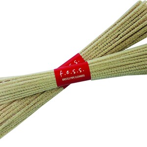 May include: A bundle of beige pipe cleaners with a red label that reads "f.e.s.s. BRISTLE PIPE CLEANERS".