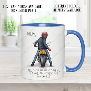 May include: White ceramic mug with a blue rim and handle. The mug features a cartoon illustration of a person riding a motorcycle with the text "Nicky" and "All dads are created equal but only the coolest ride motorbikes".