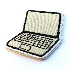 May include: Embroidered laptop patch with a cream-colored screen and keyboard, outlined in black. The patch has a white border and is designed to be ironed or sewn onto fabric. A tech-themed accessory.