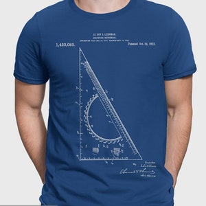 May include: A white and blue t-shirt with a vintage patent drawing of a protractor. The patent number is 1,433,083 and the patent date is October 24, 1922. The text "LE BOY L. LEISHMAN. COMPUTING INSTRUMENT." is also included in the drawing.