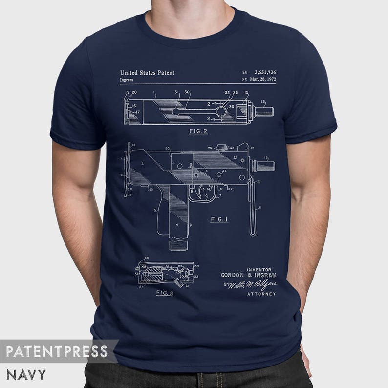 May include: A navy blue t-shirt with a white print of a patent drawing for a firearm. The drawing includes the text "United States Patent", "Ingram", "FIG. 1", "FIG. 2", "FIG. B", "3,651,736", "Mar. 28, 1972", "INVENTOR", "GORDON B. INGRAM", "Walla M. Boljen", and "ATTORNEY".