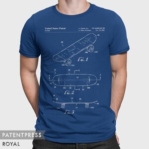 May include: A royal blue t-shirt with a white print of a skateboard patent design. The patent number is US 6,648,363 B2 and the date of the patent is Nov. 18, 2003. The text "United States Patent" and "Gordon" are also printed on the shirt.