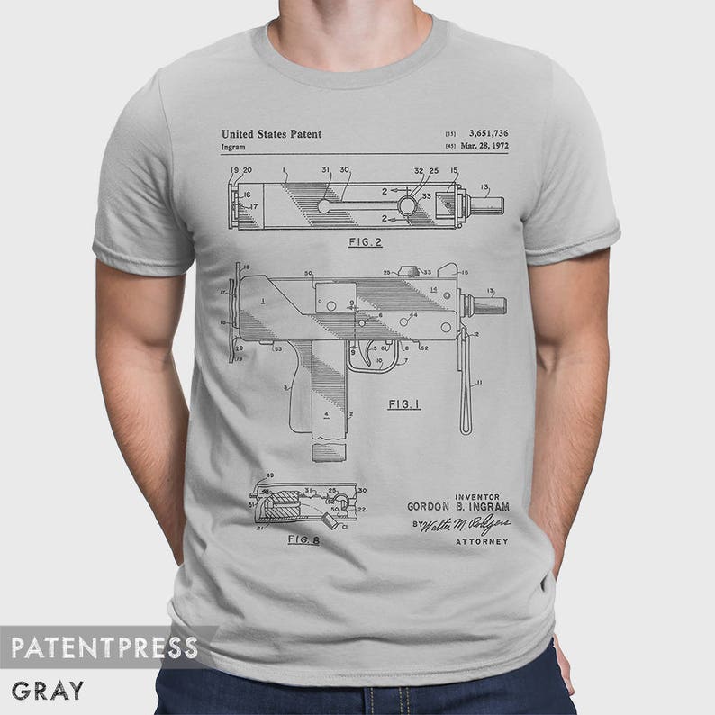 May include: A gray t-shirt with a black and white illustration of a patent for a firearm. The patent number is 3,451,736 and the date is March 28, 1972. The inventor is Gordon B. Ingram. The text "United States Patent" and "Ingram" are also visible on the shirt.