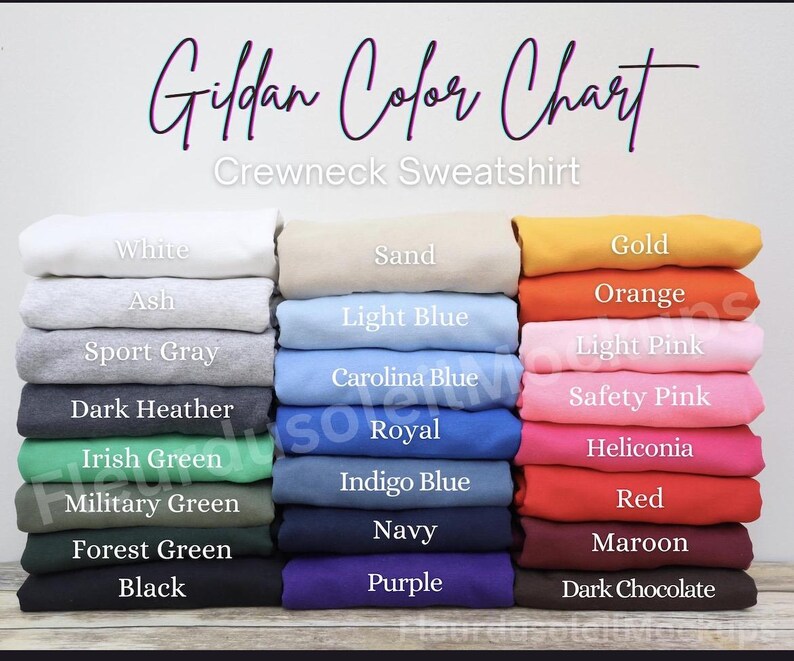 May include: A color chart for Gildan crewneck sweatshirts, showcasing a variety of colors. The chart displays folded sweatshirts in shades like white, ash, sport gray, dark heather, Irish green, military green, forest green, and black. Other colors include sand, light blue, Carolina blue, royal, indigo blue, navy, purple, gold, orange, light pink, safety pink, and red.