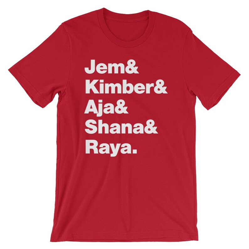 May include: Red t-shirt with white text that reads "Jem & Kimber & Aja & Shana & Raya."