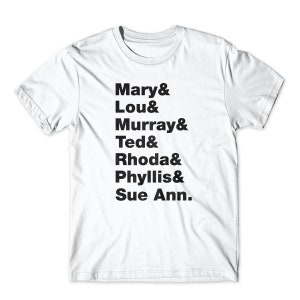 May include: White t-shirt with black text listing the names of the characters from the TV show "The Mary Tyler Moore Show": Mary, Lou, Murray, Ted, Rhoda, Phyllis, and Sue Ann.