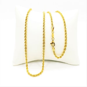 May include: A gold rope chain necklace with a lobster clasp closure.