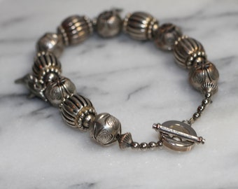 Pulseira de prata com pingente