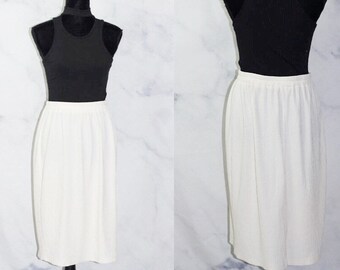 Falda plisada color crema (M)