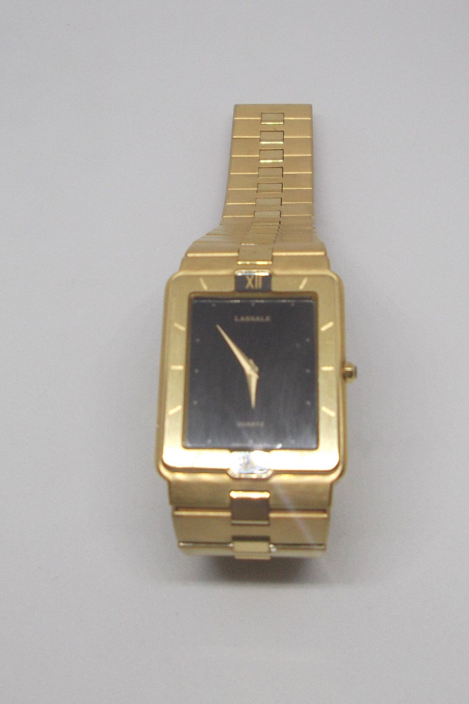 seiko gold watch with black face