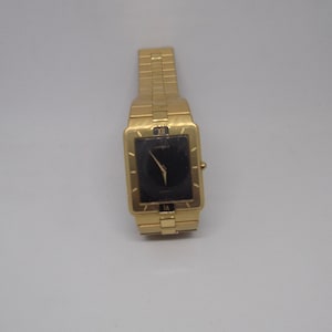 Seiko Lassale extra-flat quartz watch, gold plated, with black dial.