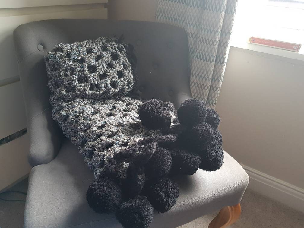 Grey granny square blanket with large black pompoms Etsy