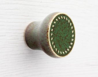 Ceramic knob for furniture No.12, dark green with brown speckles effect.