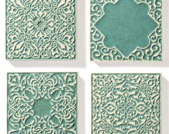 4 tiles with ornaments, mint