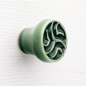 May include: A handmade wooden sign with the text "Welcome to our home" in a handwritten style. The sign is painted white with black lettering and a distressed finish, perfect for indoor or outdoor use.