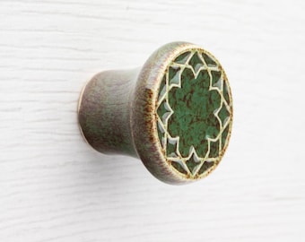 Ceramic knob for furniture No.3, dark green with brown speckles effect.