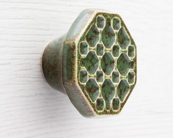 Knob for furniture No.10, dark green with brown speckles effect.