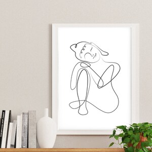 May include: A black and white line drawing of a person sitting with their head tilted back and eyes closed. The drawing is in a simple, minimalist style.