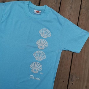 Vintage anni '80 DEADSTOCK Florida Paper Thin souvenir conchiglie di mare burro singolo sottile e morbido t-shirt Made in USA Large