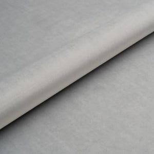 May include: A roll of light gray felt fabric.