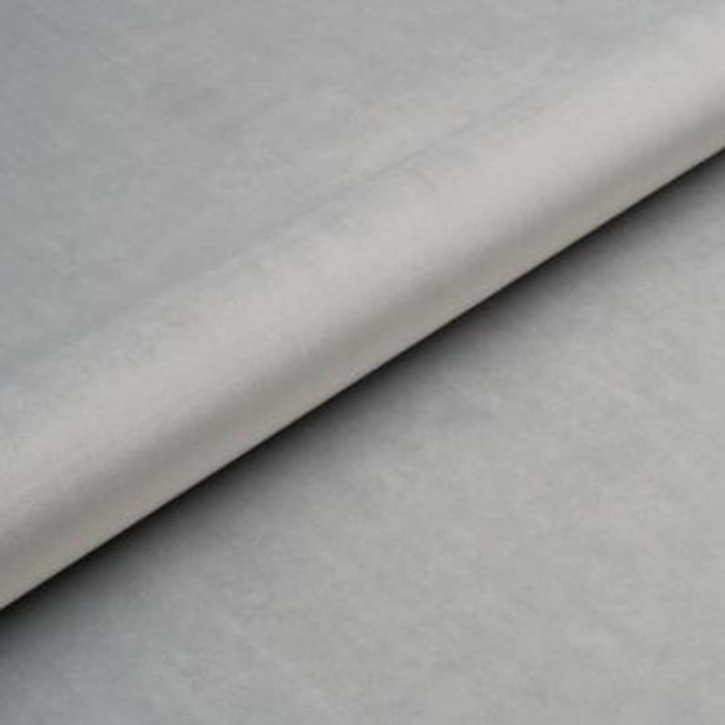 May include: A roll of light gray felt fabric.