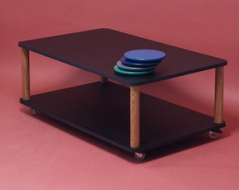 Coffee Table with Wheels and rounded corners made from solid wood and top and shelf are available in various colors