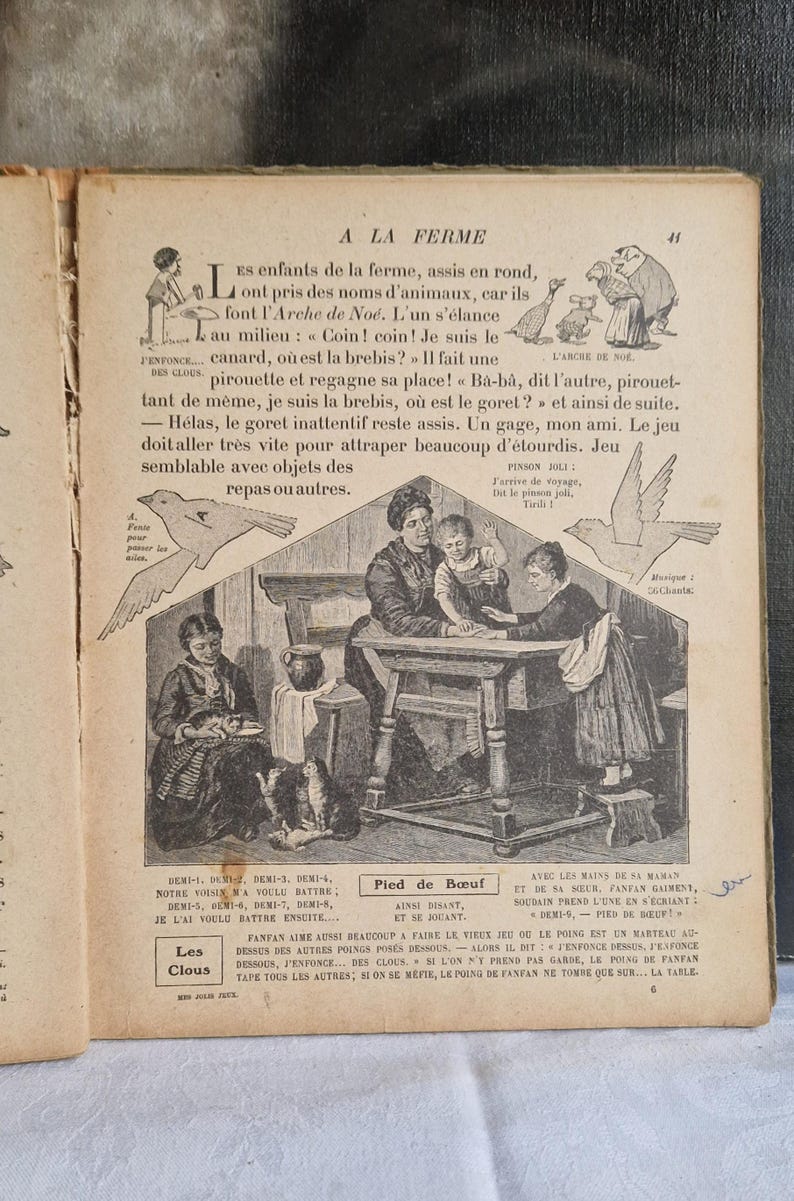 May include: An antique book page with illustrations and French text. The page features a detailed drawing of a family gathered around a table, with additional drawings of birds and children. The text is in a vintage font.