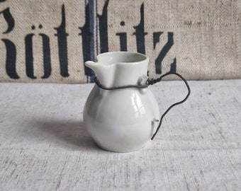 Milk jug made of porcelain with repair Shabby France vintage antique