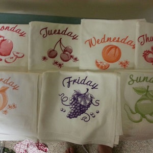 Flour sack dish towels. Days of the week fruit.