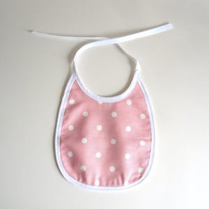 Traditional Style Baby Bib Made of 100% Pink and White Cotton Polka Dot Fabric and Plain Cotton Lining Suitable for Babies and Toddlers