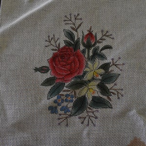 Vintage painted needlepoint. Rose, daffodils, forget-me-knots bouquet.