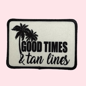 May include: White patch with black embroidered palm trees and the text "GOOD TIMES & tan lines".